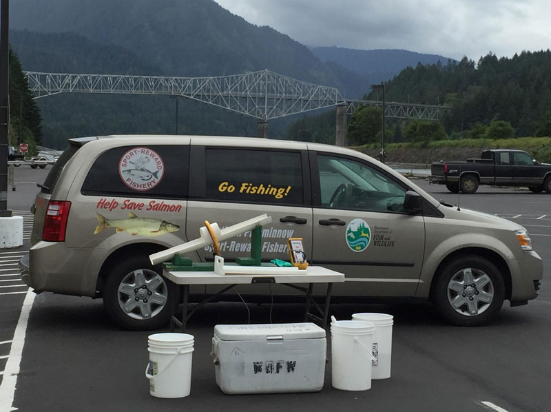 Image of Northern Pikeminnow Sport-Reward Program van at Cascade Locks Boat Ramp area.